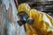 A worker removing Asbestos safely.